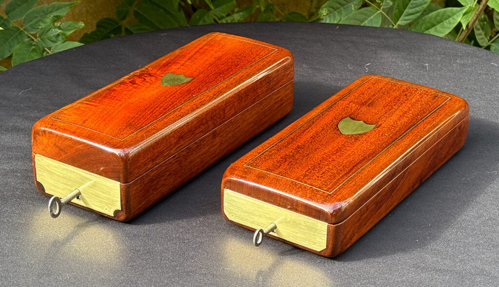 Front right view of a Pair of Small French Antique Solid Mahogany Jewellery Boxes.