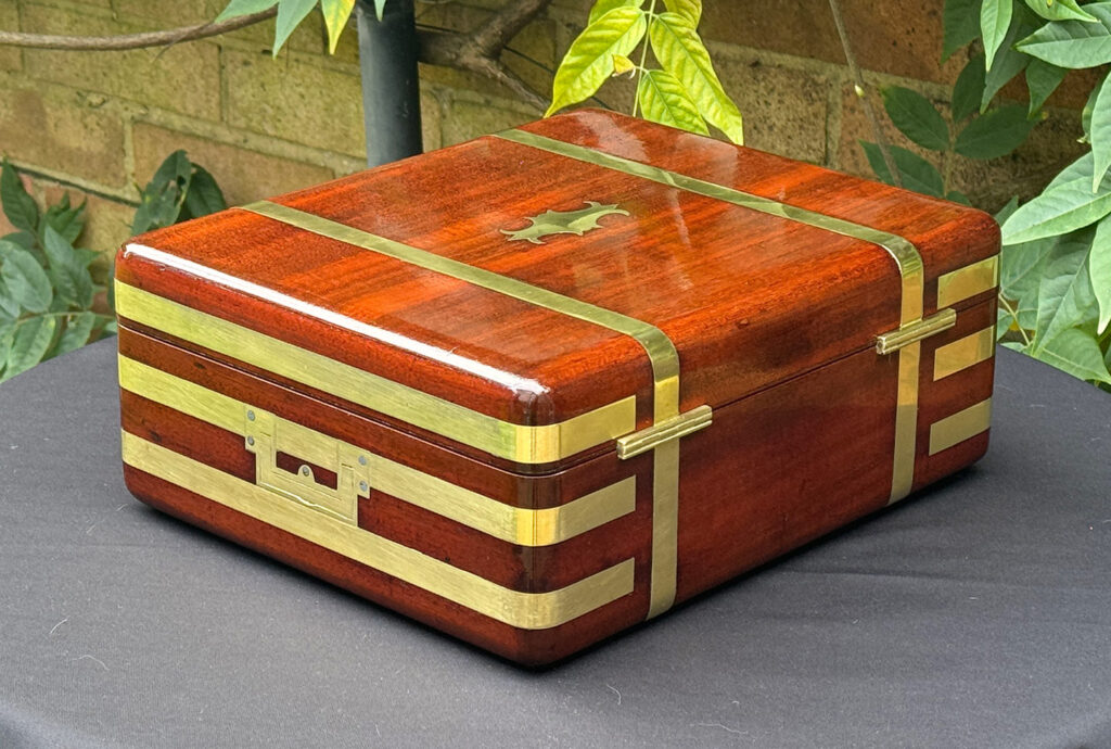 Rear right view of an Antique Radial Edged Travelling Jewellery Box in Mahogany.