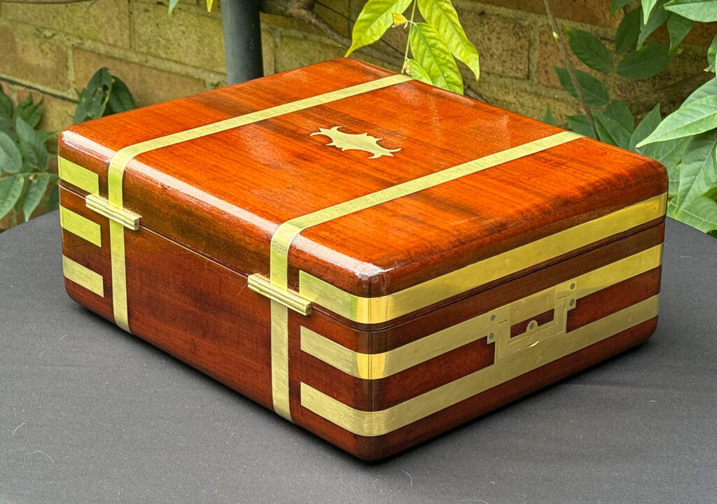Rear left view of an Antique Radial Edged Travelling Jewellery Box in Mahogany.