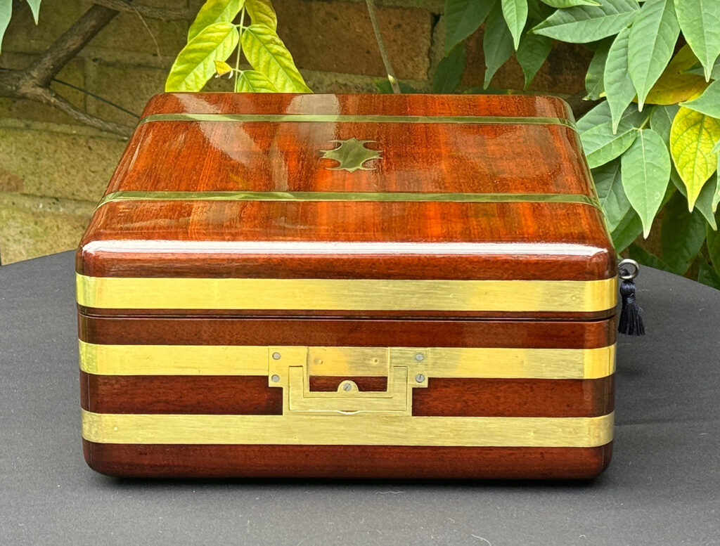 Left side view of an Antique Radial Edged Travelling Jewellery Box in Mahogany.