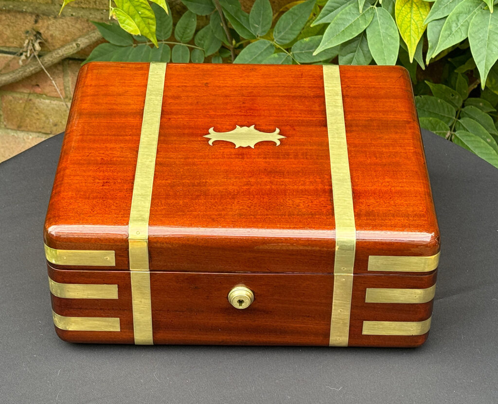Top view of an Antique Radial Edged Travelling Jewellery Box in Mahogany.