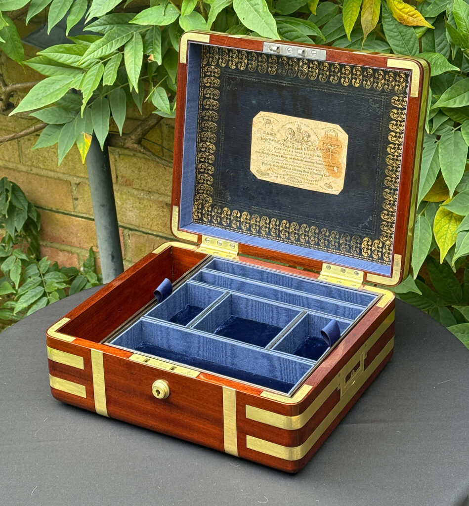 Front right internal view of an Antique Radial Edged Travelling Jewellery Box in Mahogany.
