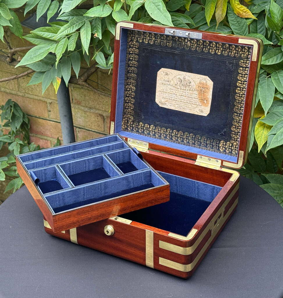 Front internal view of an Antique Radial Edged Travelling Jewellery Box in Mahogany with tray removed.