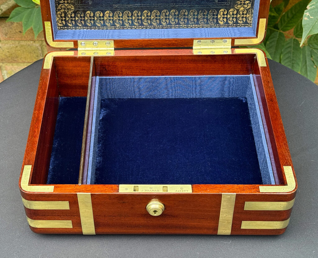 Close up of interior from an Antique Radial Edged Travelling Jewellery Box in Mahogany.