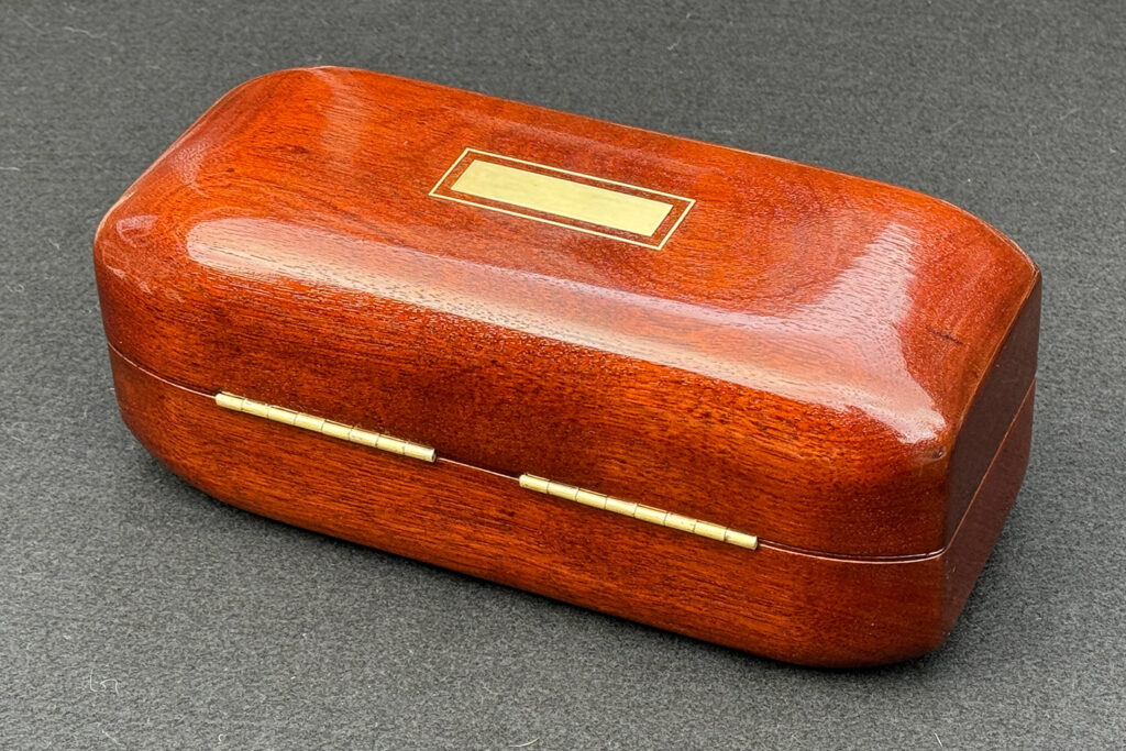 Rear view of an Antique Radial Edged Jewellery Box in Cuban Mahogany.