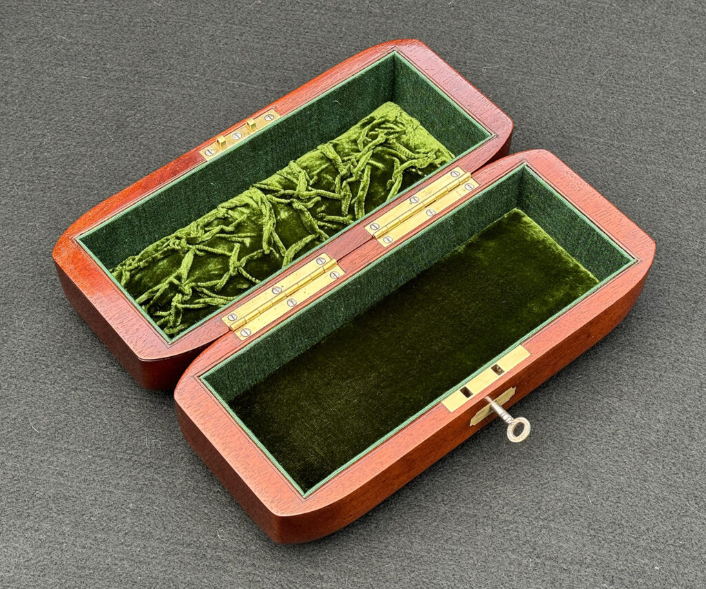 Angled overhead internal view of an Antique Radial Edged Jewellery Box in Cuban Mahogany.