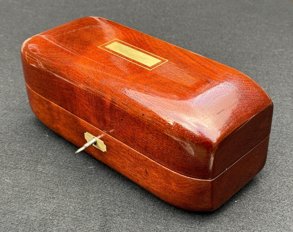 Front right view of an Antique Radial Edged Jewellery Box in Cuban Mahogany.
