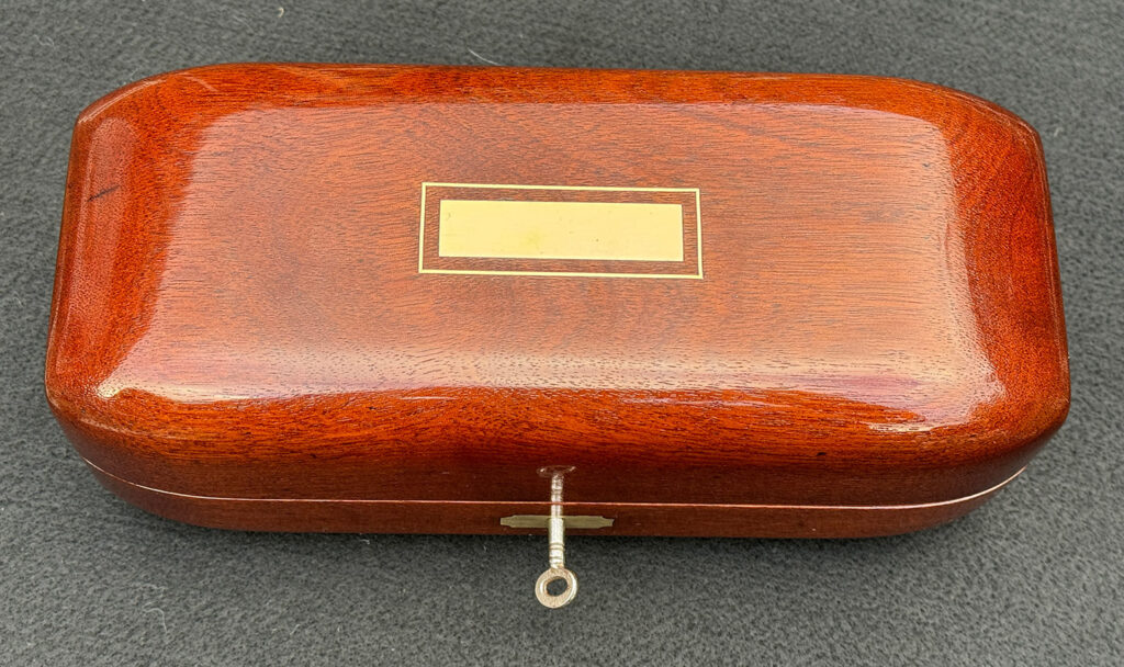 Top view of an Antique Radial Edged Jewellery Box in Cuban Mahogany.