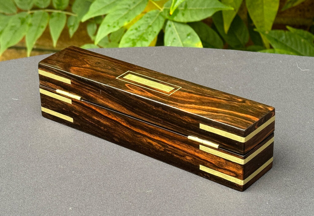 Rear left view of an Antique Miniature Pocket Jewellery Box in Calamander.