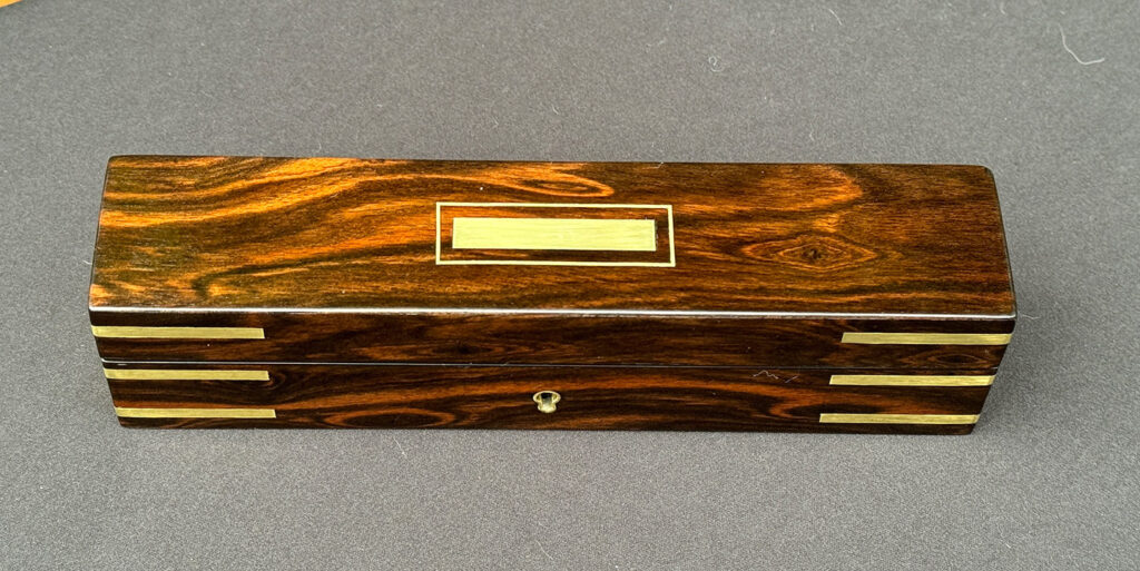 Top view of an Antique Miniature Pocket Jewellery Box in Calamander.