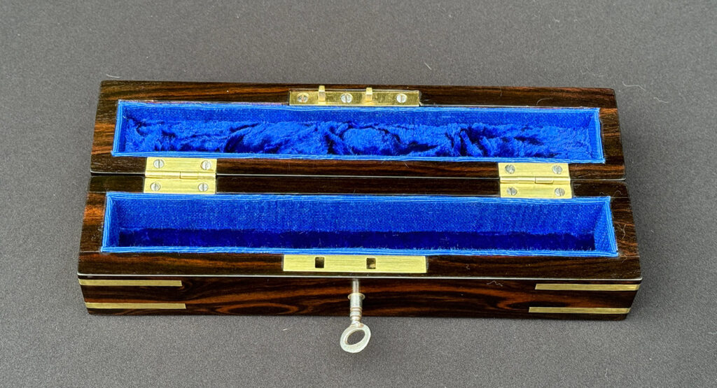 Top internal view of an Antique Miniature Pocket Jewellery Box in Calamander.