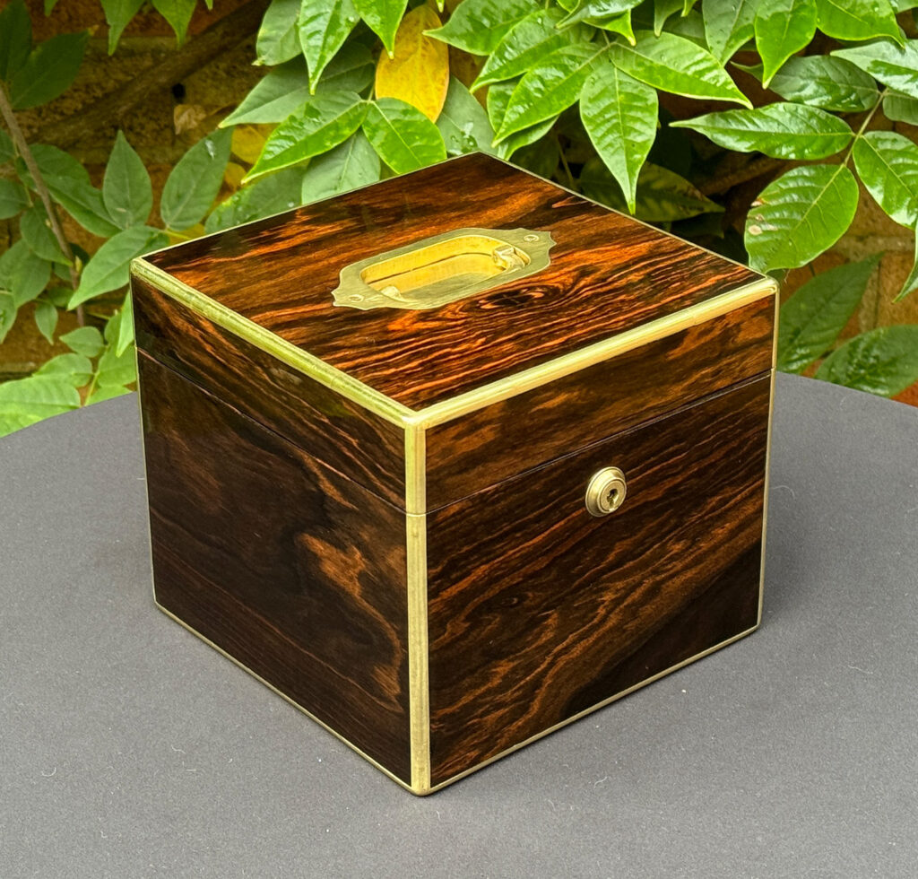 Front left view of an Antique Miniature Coromandel Cubed Jewellery Box.