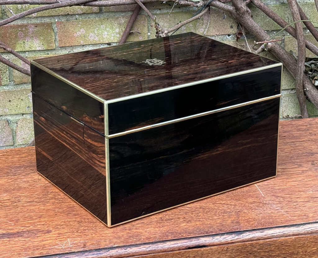 Rear right view of an Antique Jewellery Box in Coromandel with Betjemann Patent Automatic Mechanism, by Fisher.