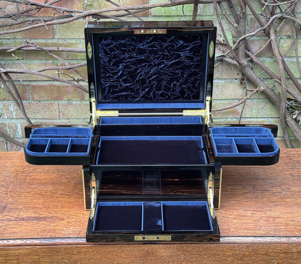 Front internal view of an Antique Jewellery Box in Coromandel with Betjemann Patent Automatic Mechanism, by Fisher.