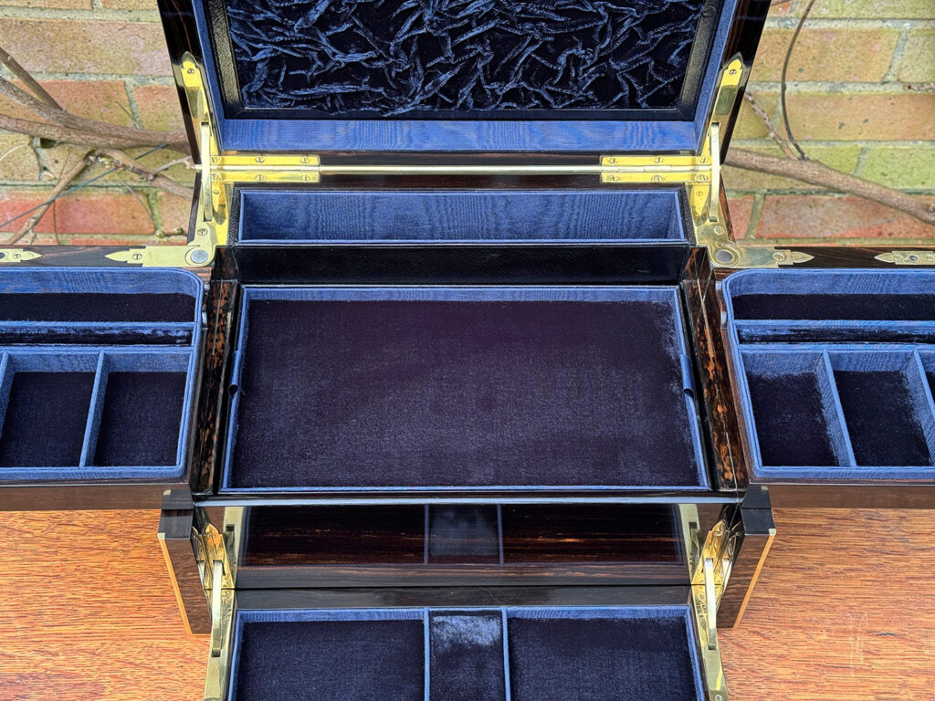Closer interior view of an Antique Jewellery Box in Coromandel with Betjemann Patent Automatic Mechanism, by Fisher.
