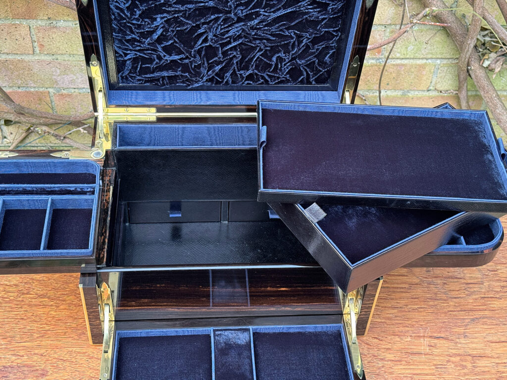 Closer interior view of an Antique Jewellery Box in Coromandel with Betjemann Patent Automatic Mechanism, by Fisher with both trays removed.