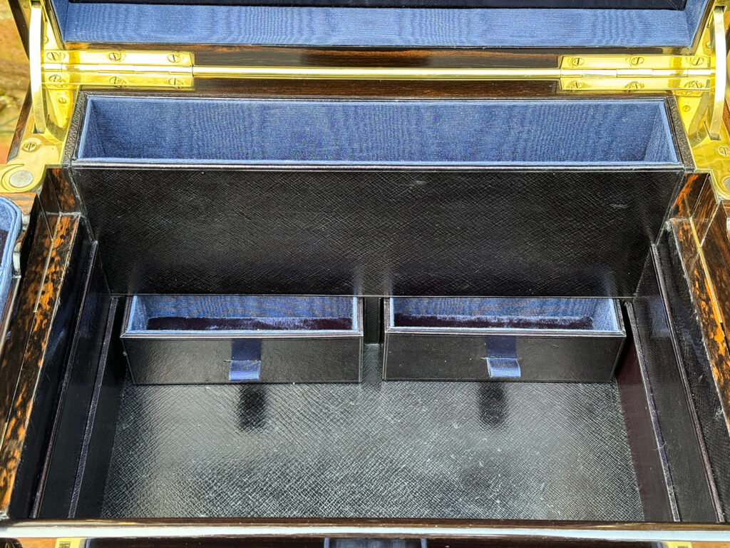Close up view of the concealed lower drawers from an Antique Jewellery Box in Coromandel with Betjemann Patent Automatic Mechanism, by Fisher.
