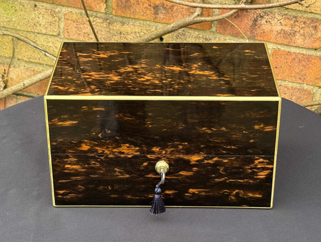 Front view of an Antique 180-Degree Opening Travelling Jewellery Box in Coromandel.