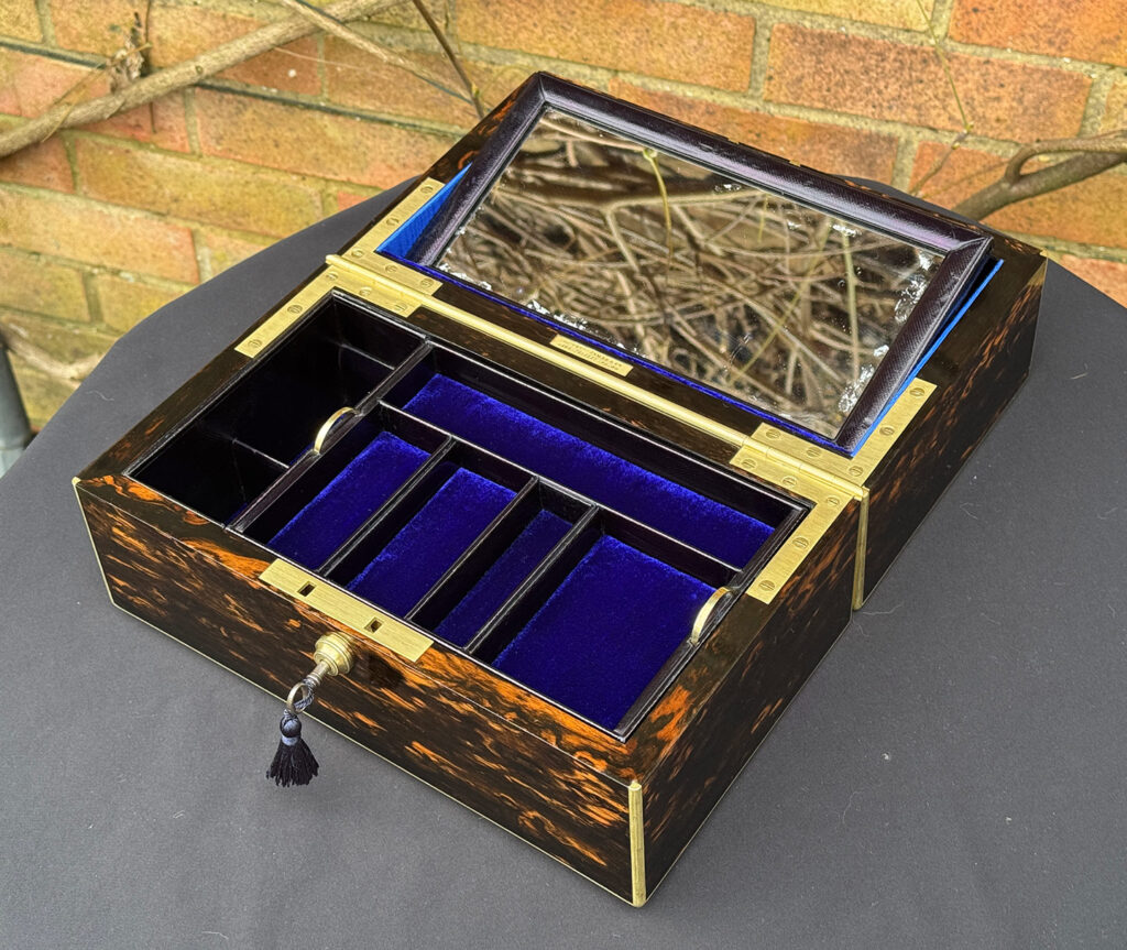 Front right internal view of an Antique 180-Degree Opening Travelling Jewellery Box in Coromandel with mirror raised.