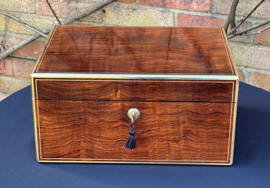 Front view of an Antique Jewellery Box in Rosewood, by Edwards.