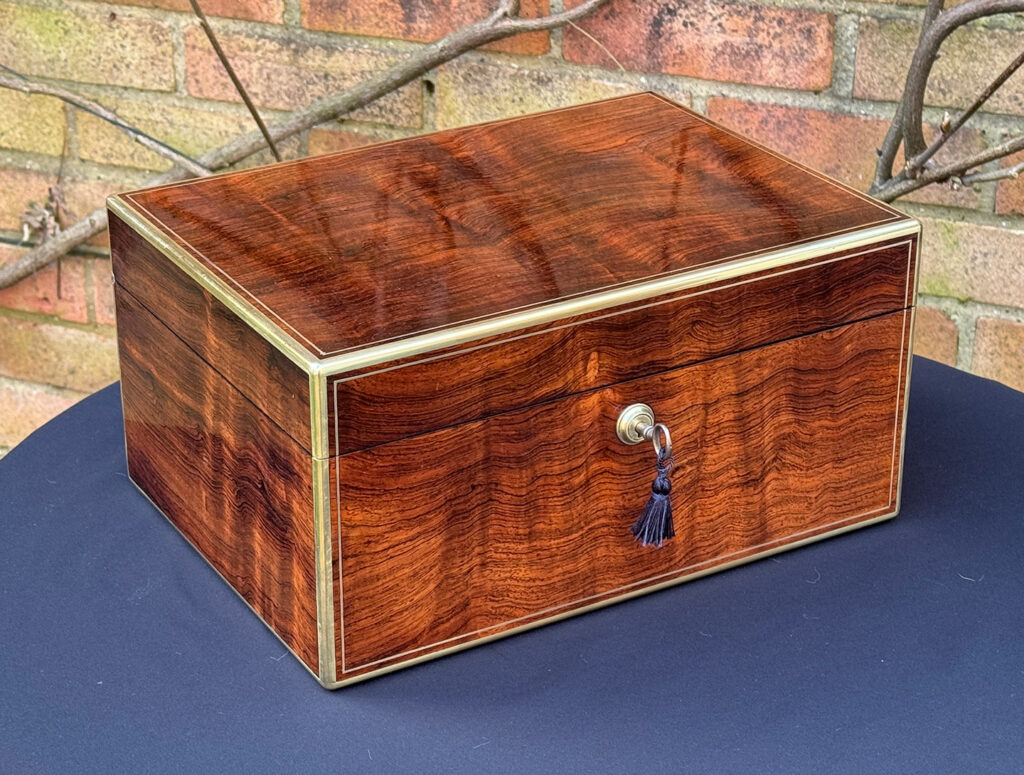 Front left view of an Antique Jewellery Box in Rosewood, by Edwards.