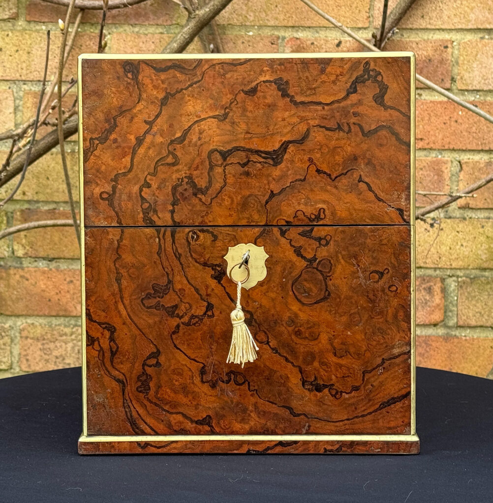 Front view of an Antique Jewellery Box in Figured Walnut, by George Betjemann and Sons.