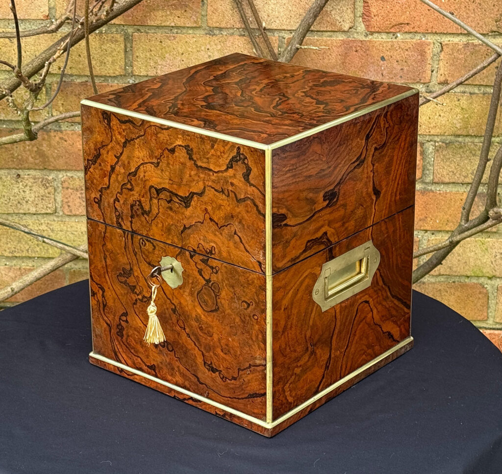 Front right view of an Antique Jewellery Box in Figured Walnut, by George Betjemann and Sons.