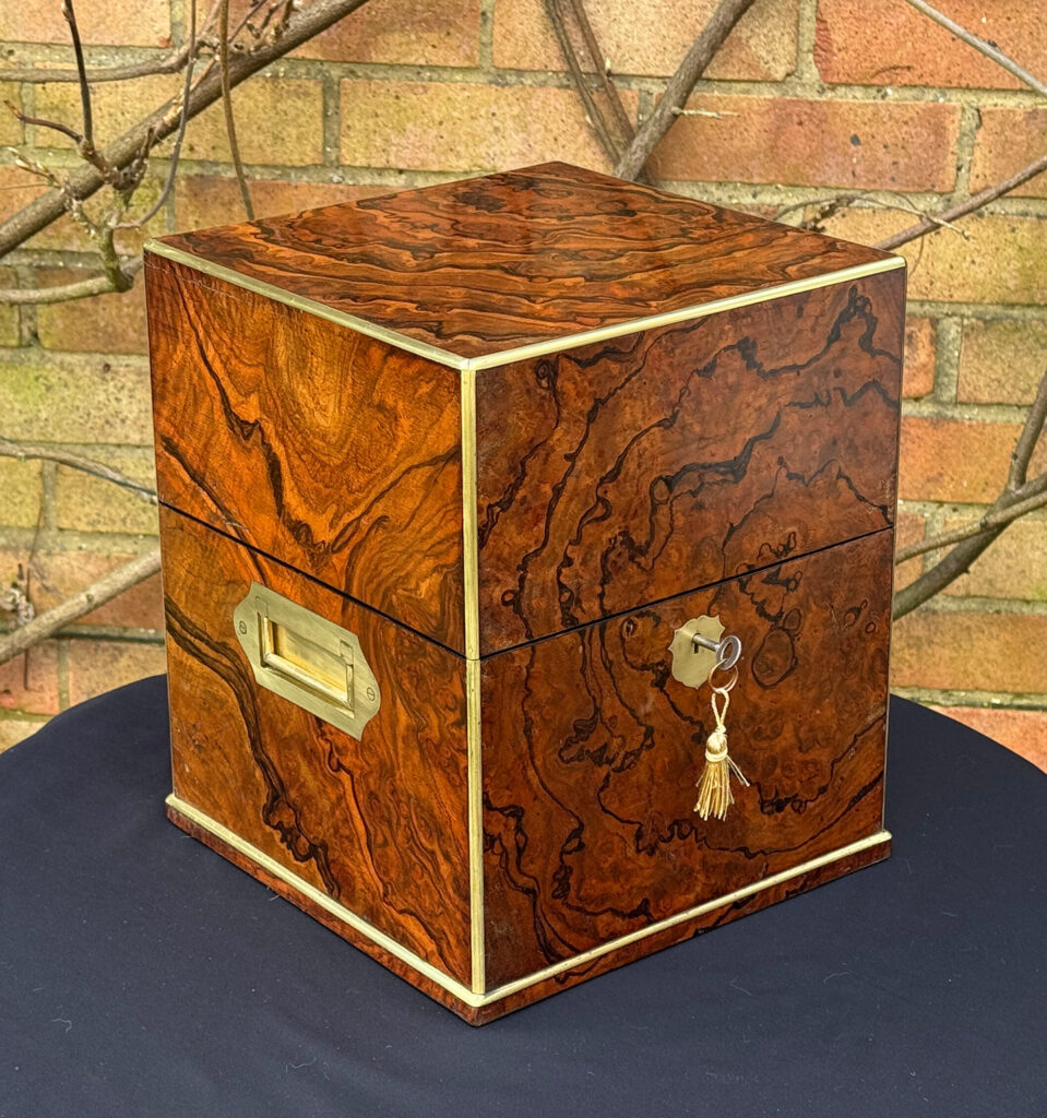 Front left view of an Antique Jewellery Box in Figured Walnut, by George Betjemann and Sons.