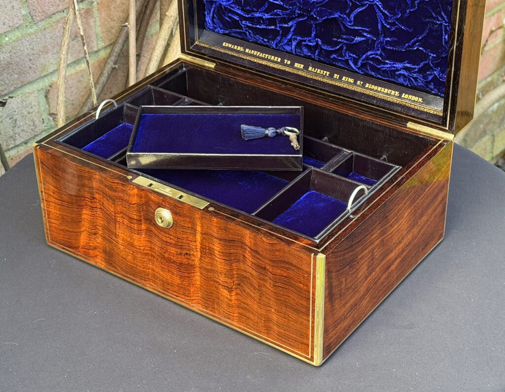 Close up internal view of an Antique Jewellery Box in Rosewood, by Edwards with tray removed.