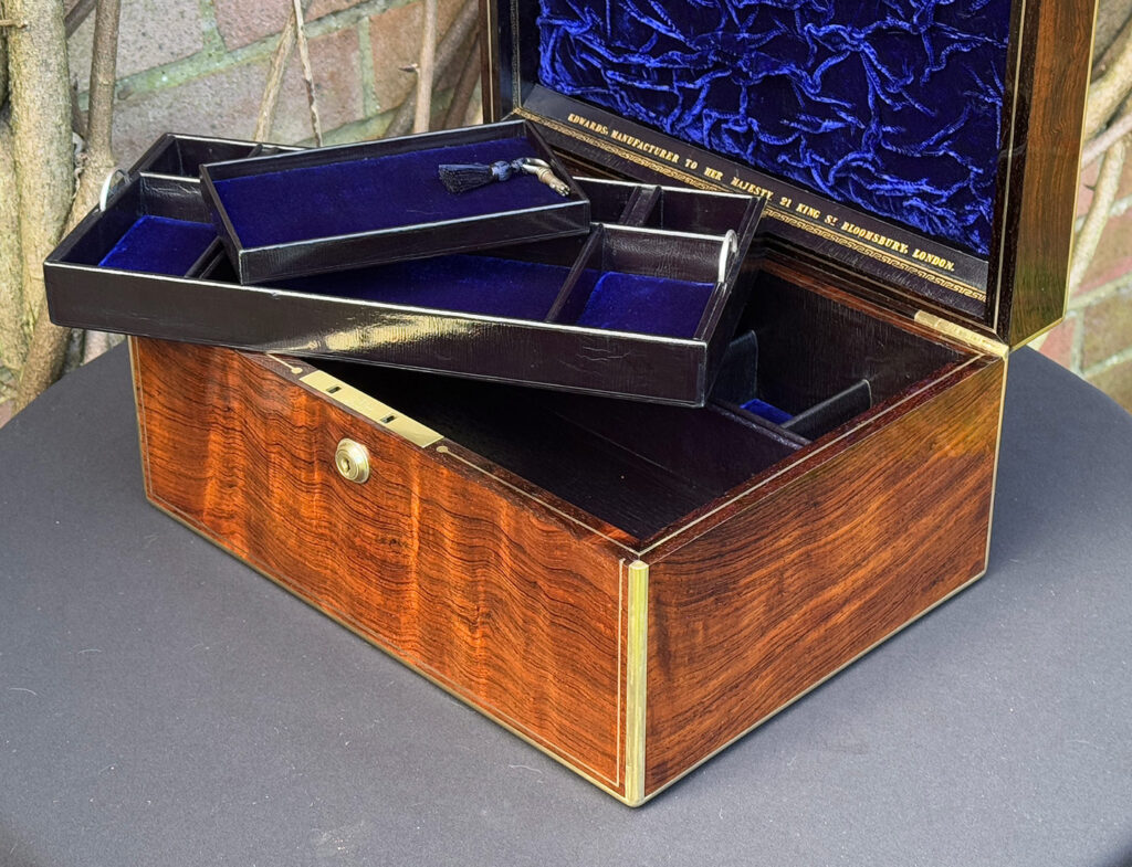 Close up internal view of an Antique Jewellery Box in Rosewood, by Edwards with trays removed.