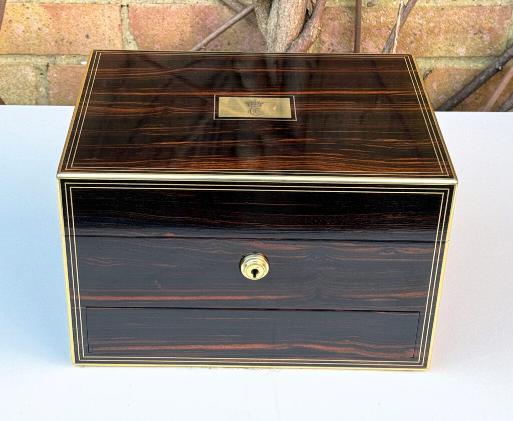 Front view of an Antique Jewellery Box in Calamander, by Austin of Dublin.