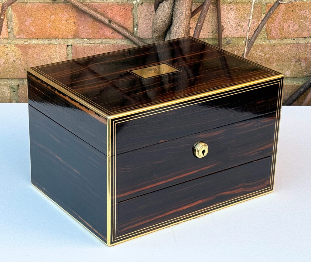 Front left view of an Antique Jewellery Box in Calamander, by Austin of Dublin.
