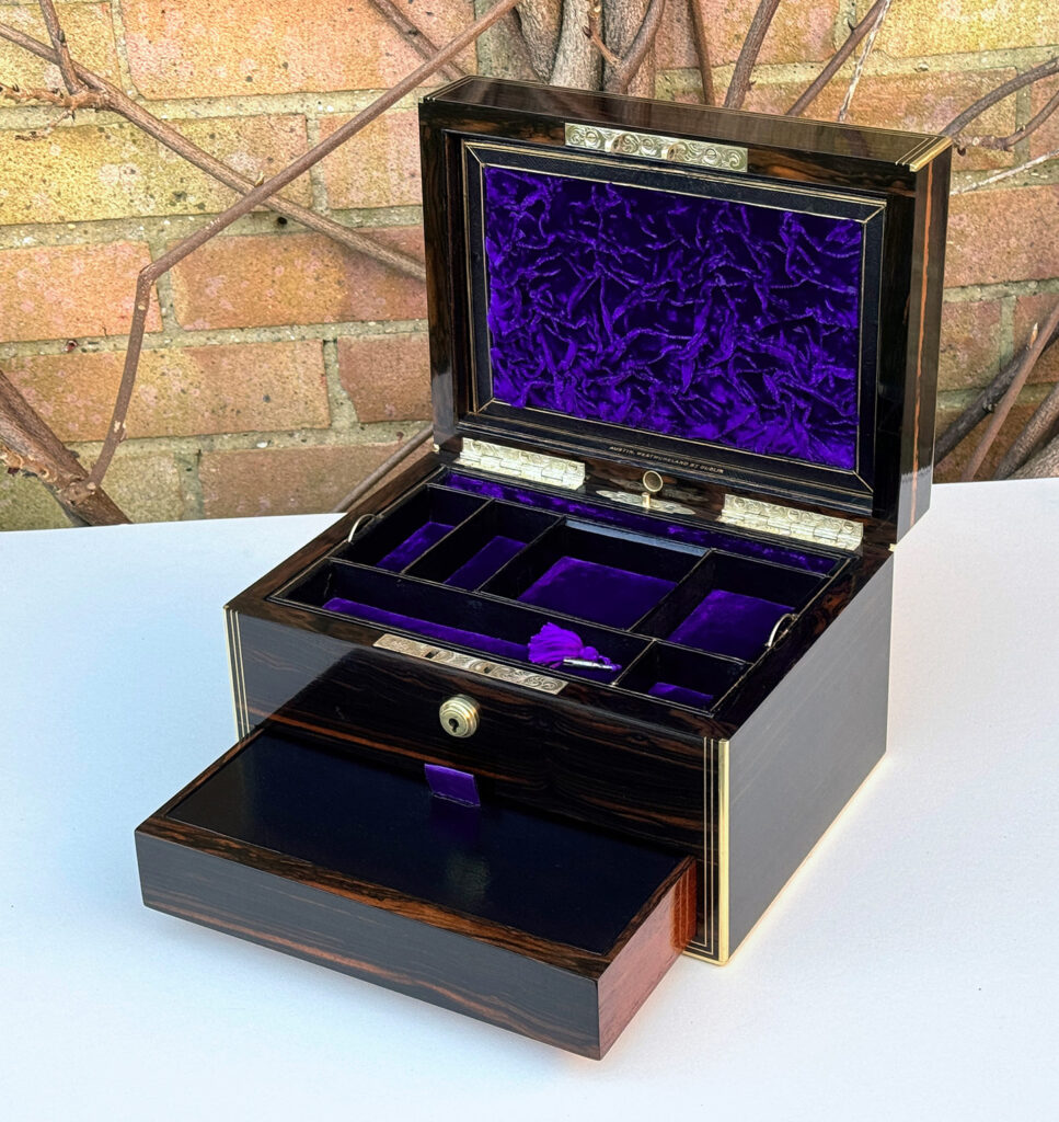 Front right internal view of an Antique Jewellery Box in Calamander, by Austin of Dublin with lower drawer open.