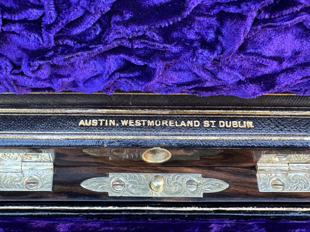 Close up of makers mark from an Antique Jewellery Box in Calamander, by Austin of Dublin.