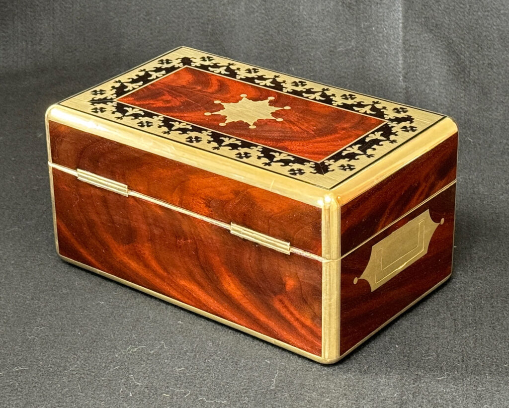 Rear left view of an Antique Miniature Jewellery Box in Flame Mahogany with Brass & Ebony Inlay.