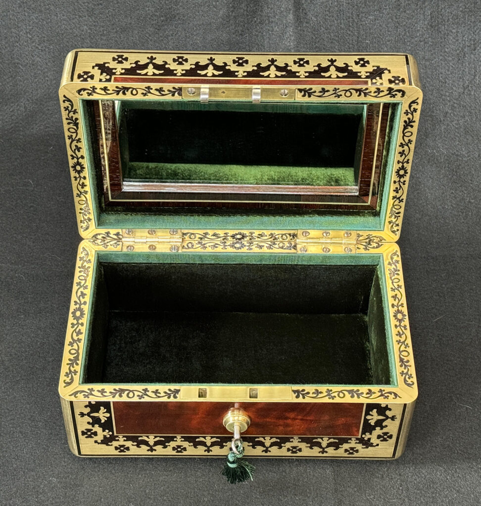 Overhead internal view of an Antique Miniature Jewellery Box in Flame Mahogany with Brass & Ebony Inlay.