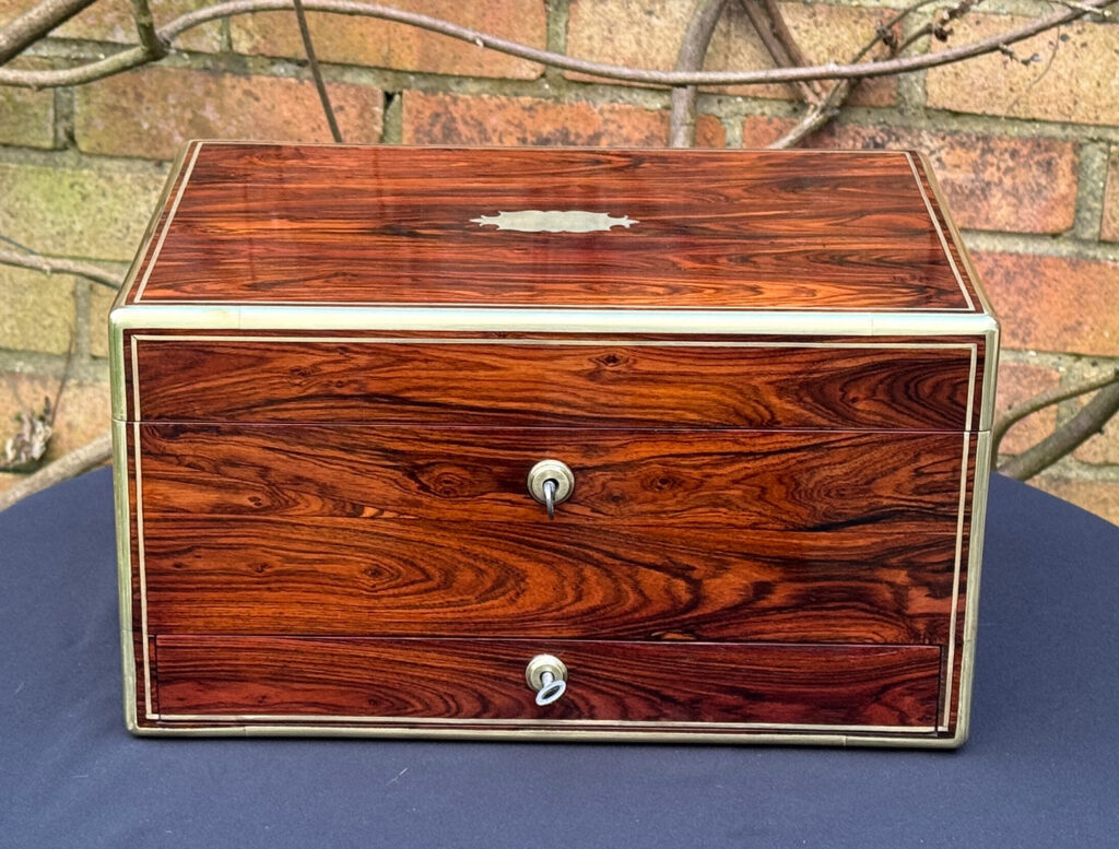 Front view of an Antique Jewellery Box in Kingwood, by Green of Oxford Street.
