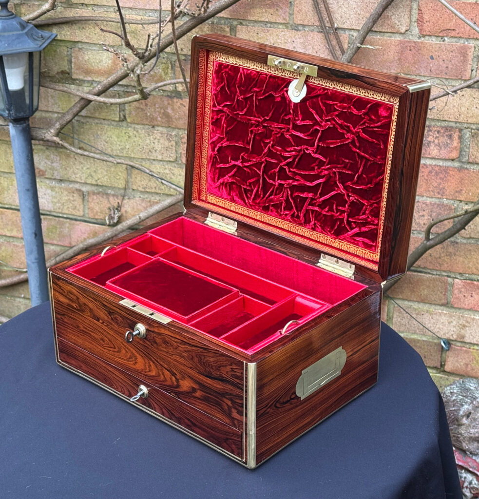 Front right internal view of an Antique Jewellery Box in Kingwood, by Green of Oxford Street with lower drawer closed.