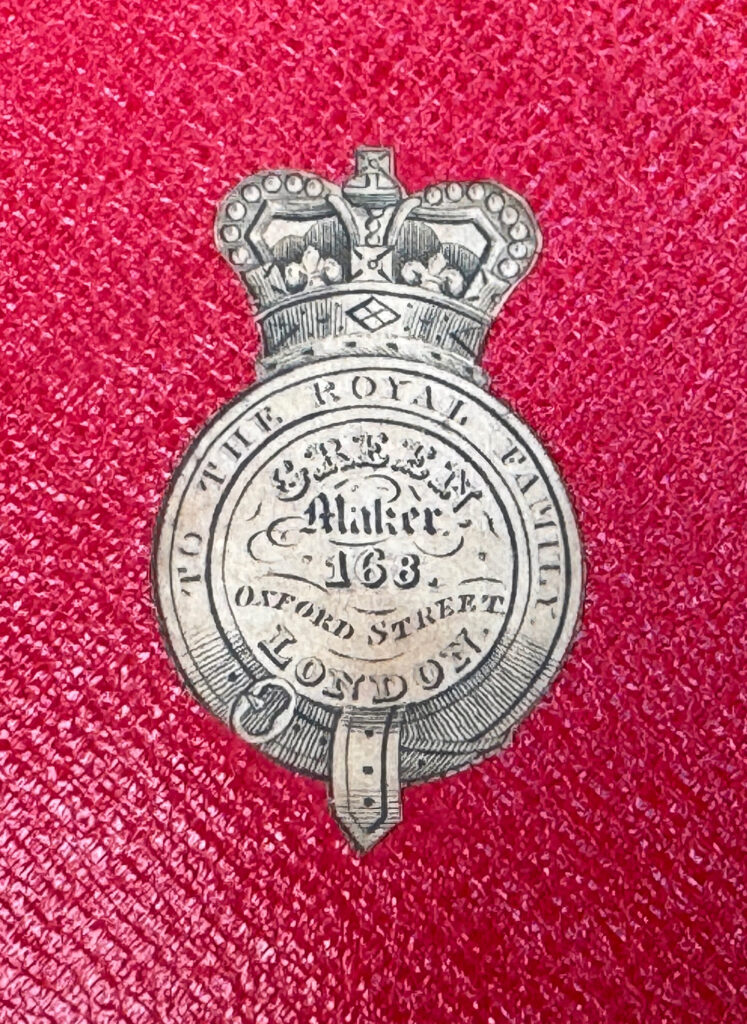 Close up of makers label from an Antique Jewellery Box in Kingwood, by Green of Oxford Street.