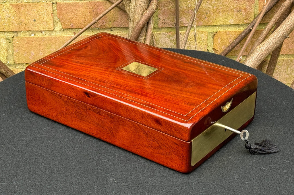 Front left view of a Large French Antique Travelling Jewellery Box in Cuban Mahogany.