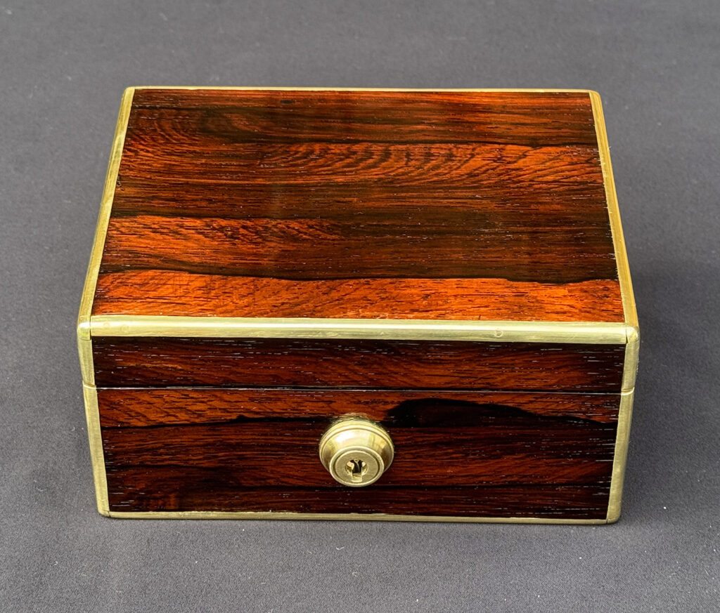 Overhead view of a Miniature Antique Jewellery Box in Rosewood, by Edwards.