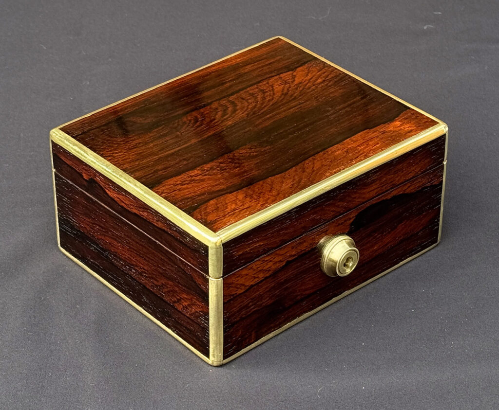Front left view of a Miniature Antique Jewellery Box in Rosewood, by Edwards.