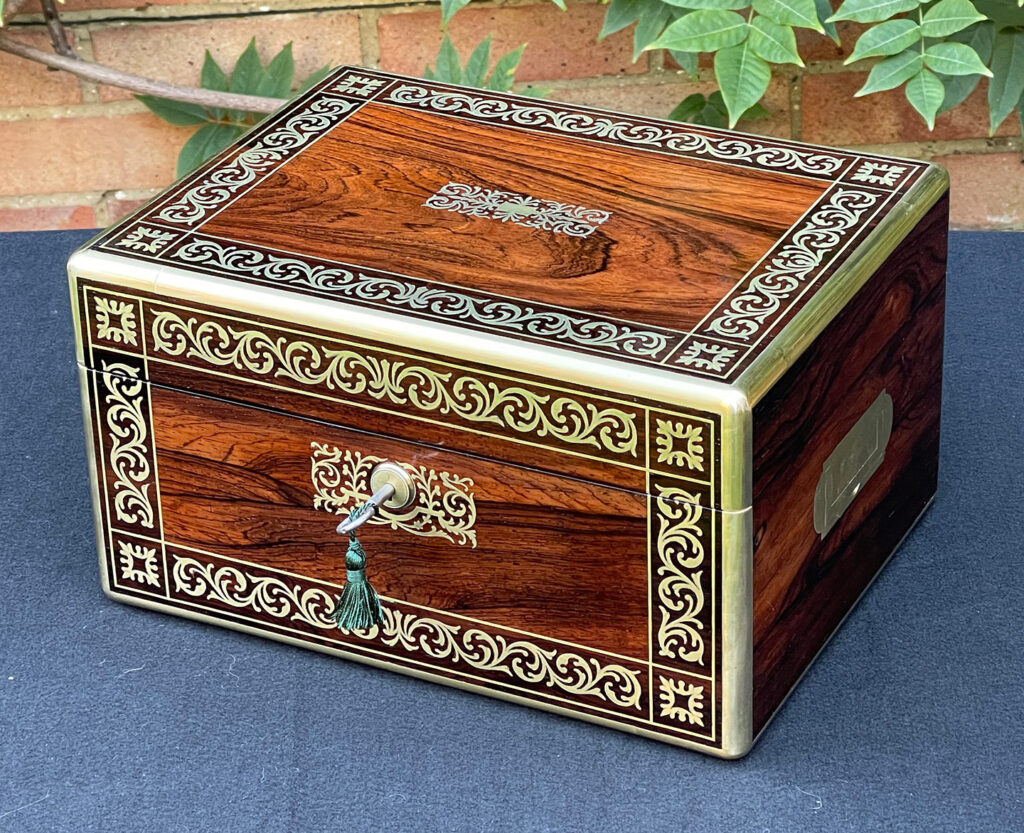 Front right view of an Antique Jewellery Box in Rosewood with Scrollwork Brass Inlay.