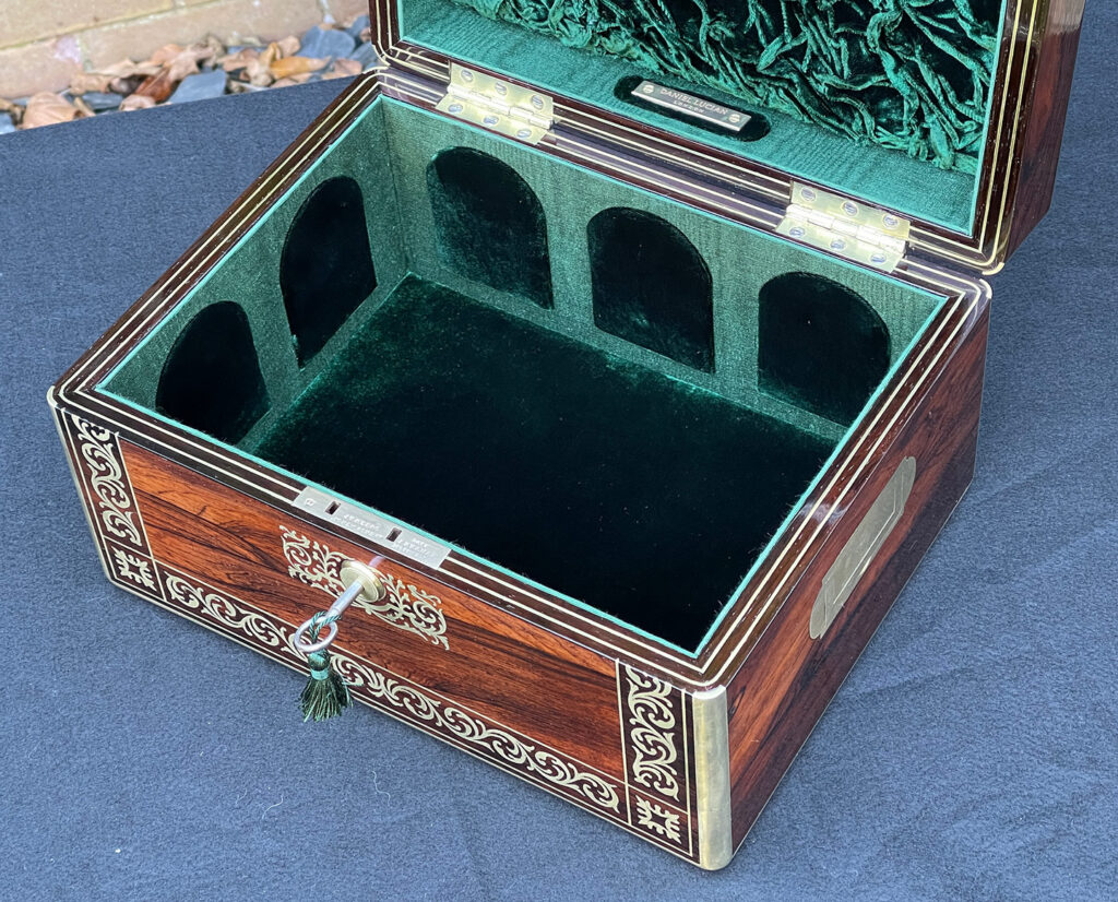 Closer interior view of an Antique Jewellery Box in Rosewood with Scrollwork Brass Inlay.
