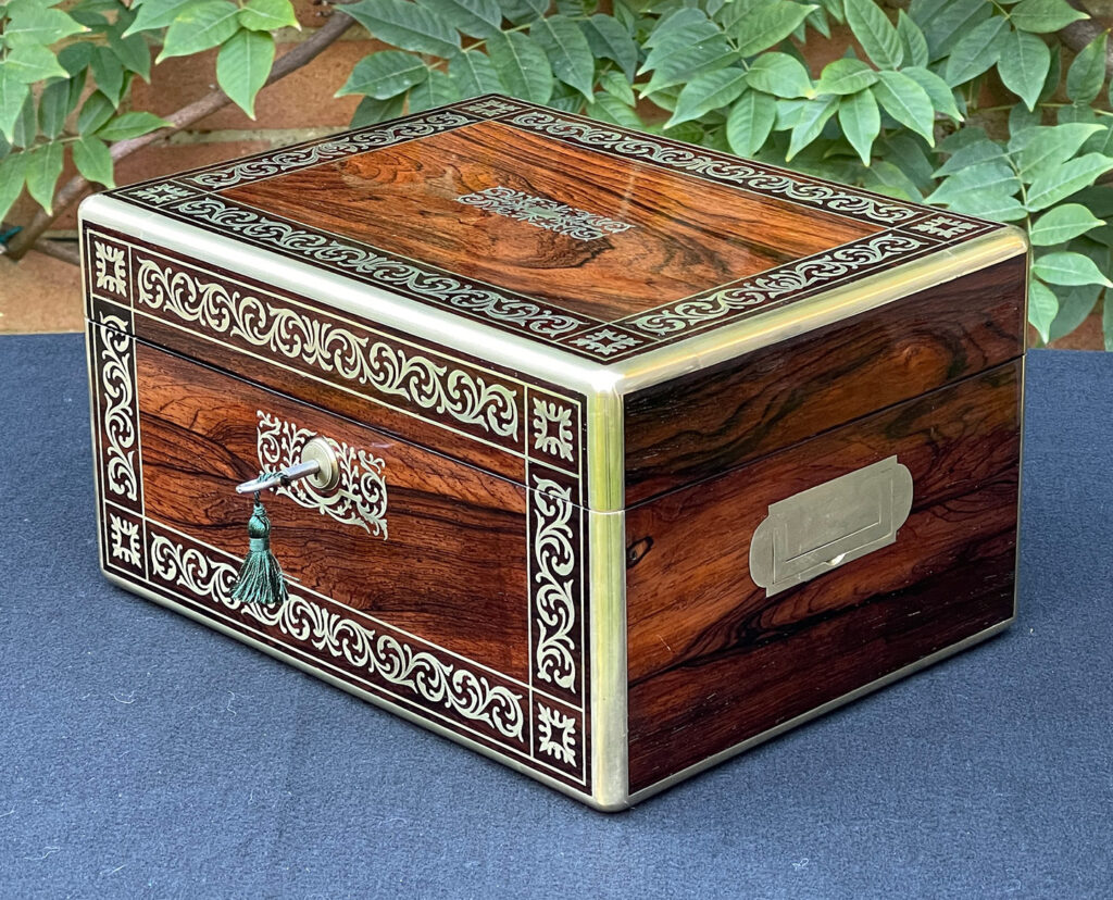 Front right view of an Antique Jewellery Box in Rosewood with Scrollwork Brass Inlay.