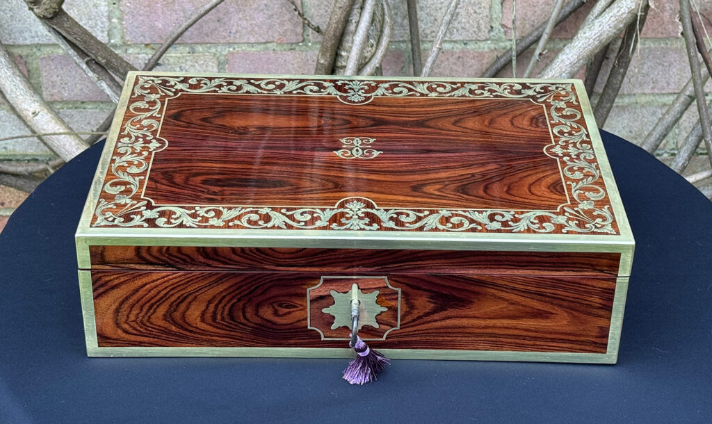 Front view of an Antique Jewellery Box in Kingwood with Brass Inlay, by Wells and Lambe.