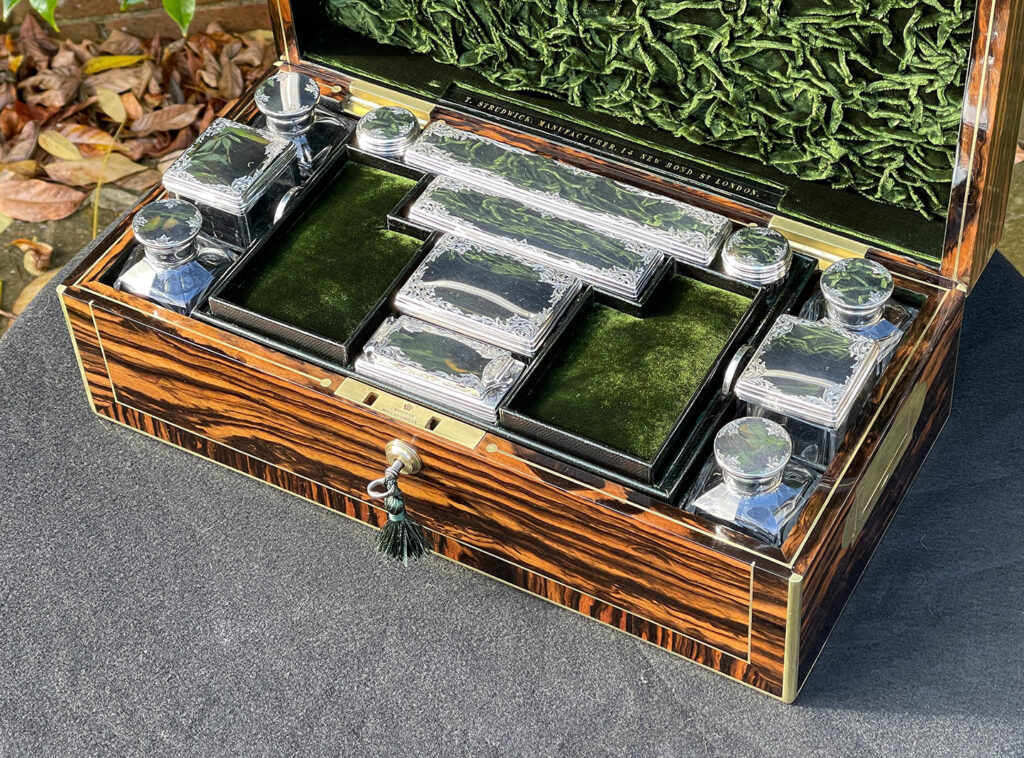 Close up internal view of an Antique Silver Mounted Dressing Case in Calamander, by Thomas Strudwick.