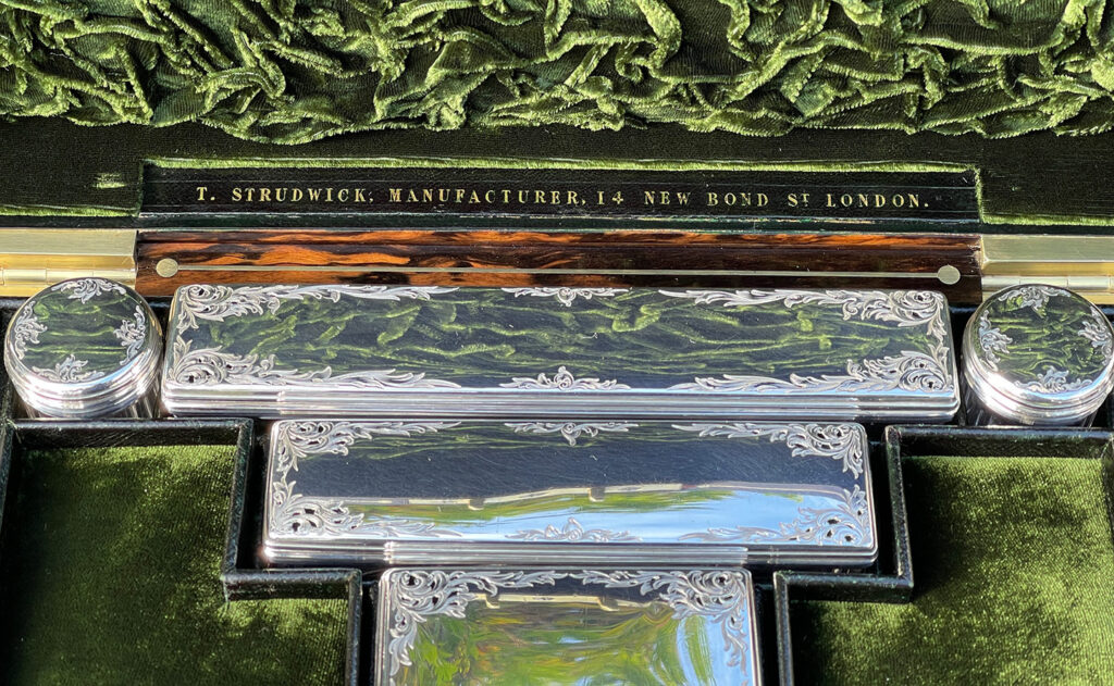 Close up of the silver mounted jars from an Antique Silver Mounted Dressing Case in Calamander, by Thomas Strudwick.