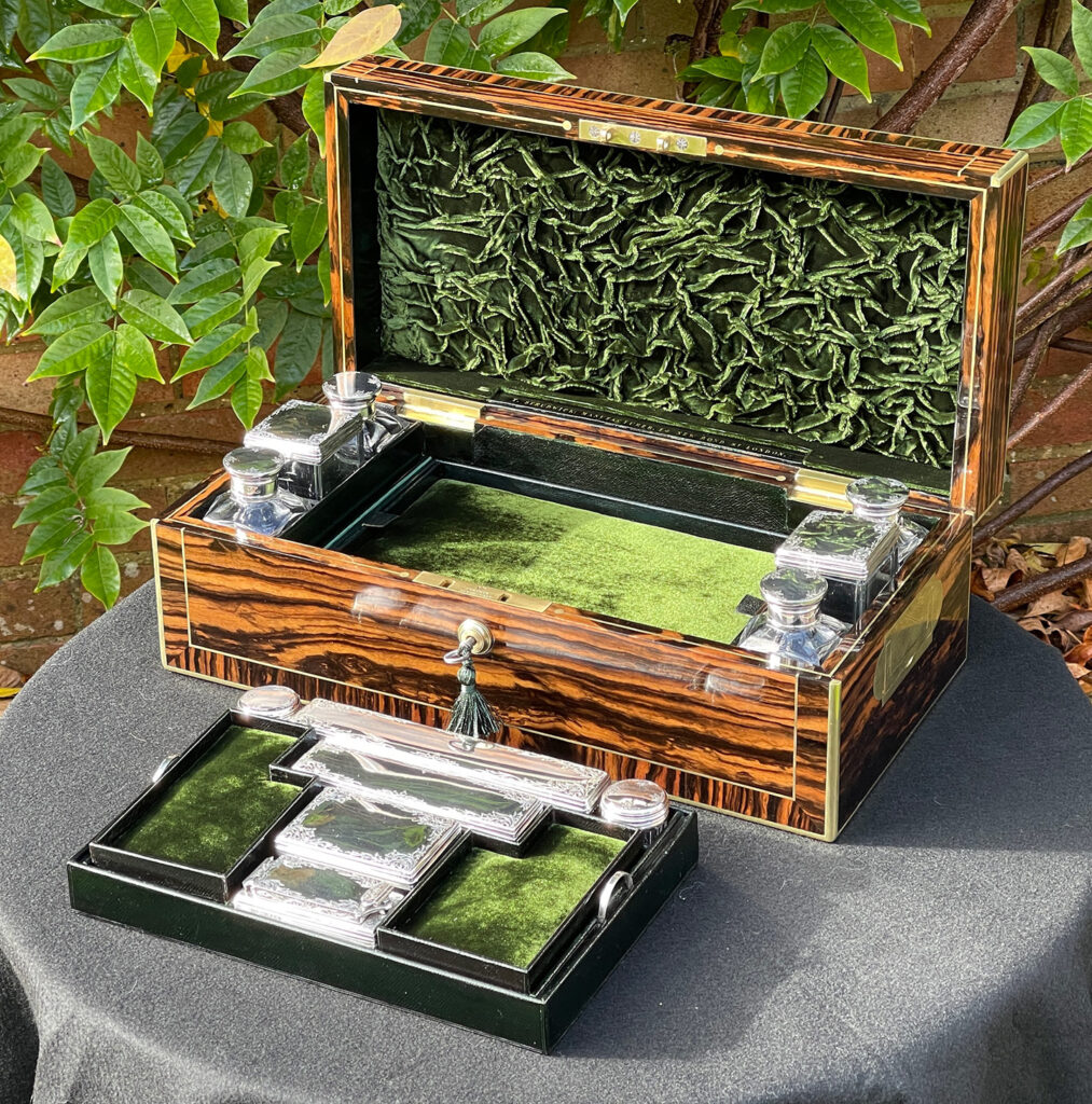 Front right internal view of an Antique Silver Mounted Dressing Case in Calamander, by Thomas Strudwick with main tray removed.