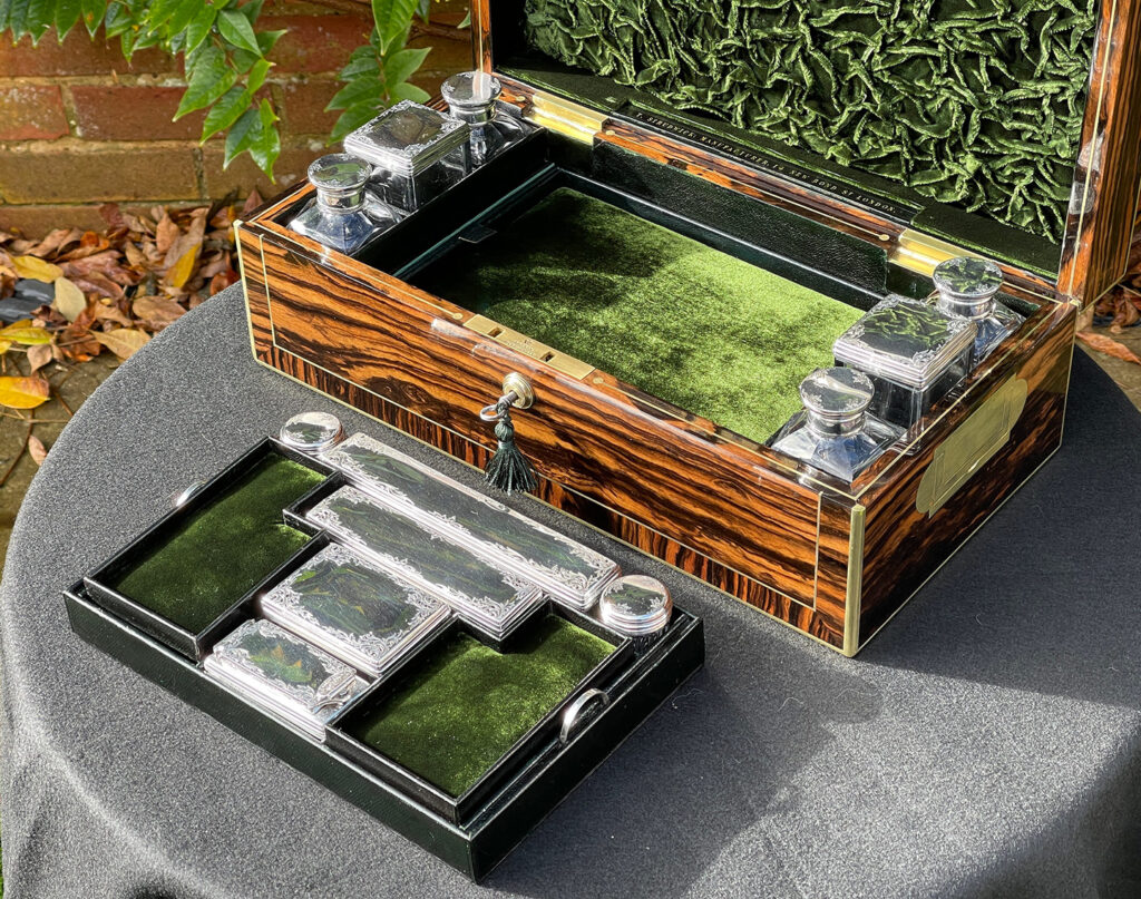 Overhead open view of an Antique Silver Mounted Dressing Case in Calamander, by Thomas Strudwick.